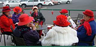 Susanville Red Hats Caroling with their Kazoos